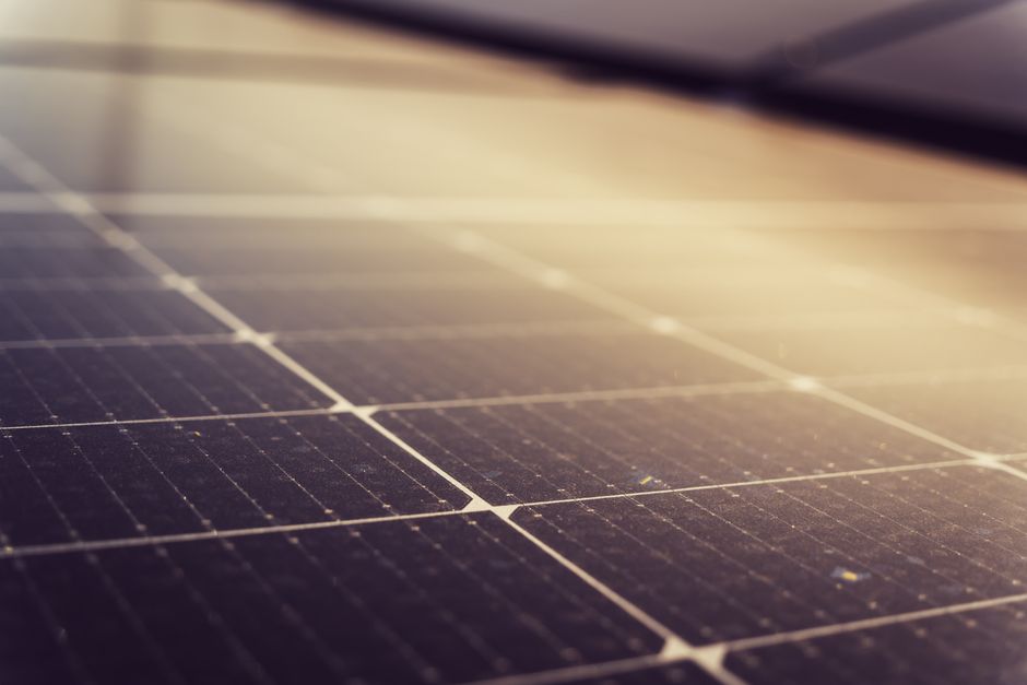 Sun shining brightly over a high-efficiency solar panel